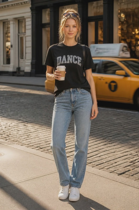 Black custom unisex t-shirt featuring a sparkling sequin and vinyl DANCE design across the front
